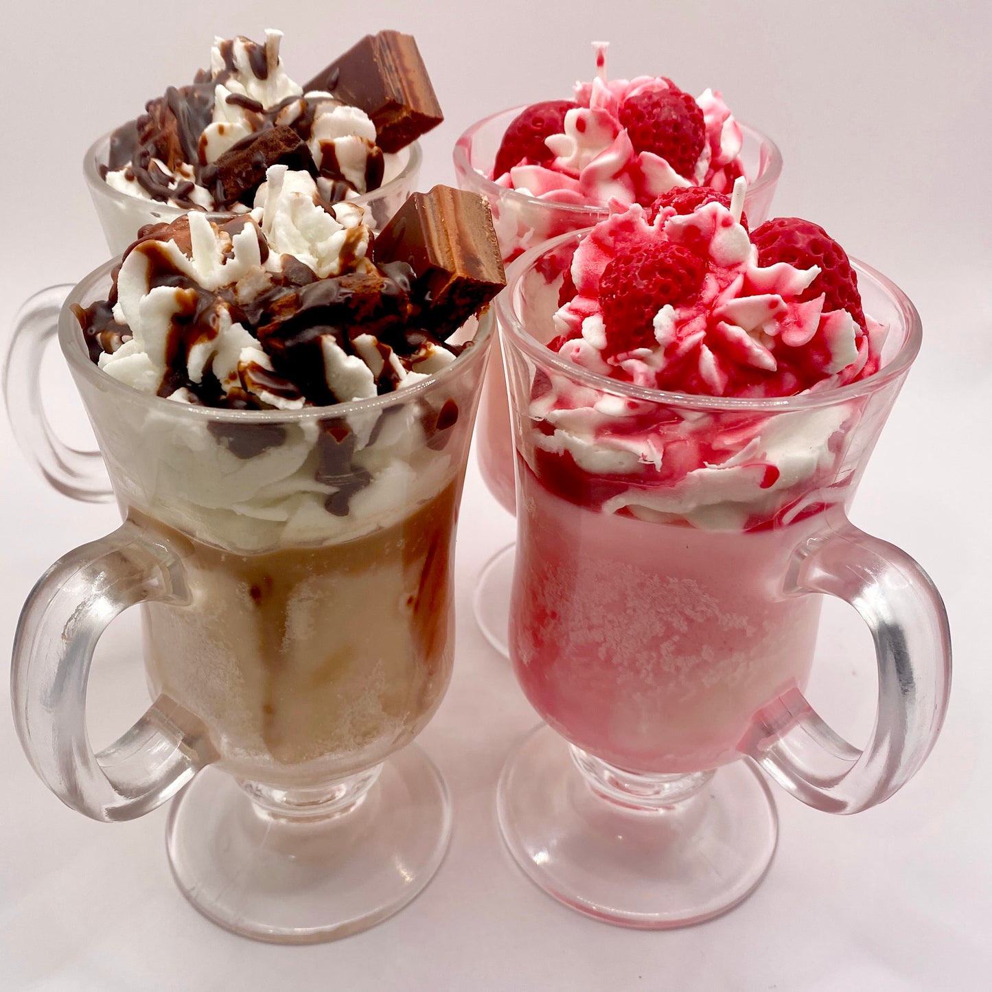 Strawberry sundae soy candle with flame lit, creating cozy ambiance in dessert-themed jar