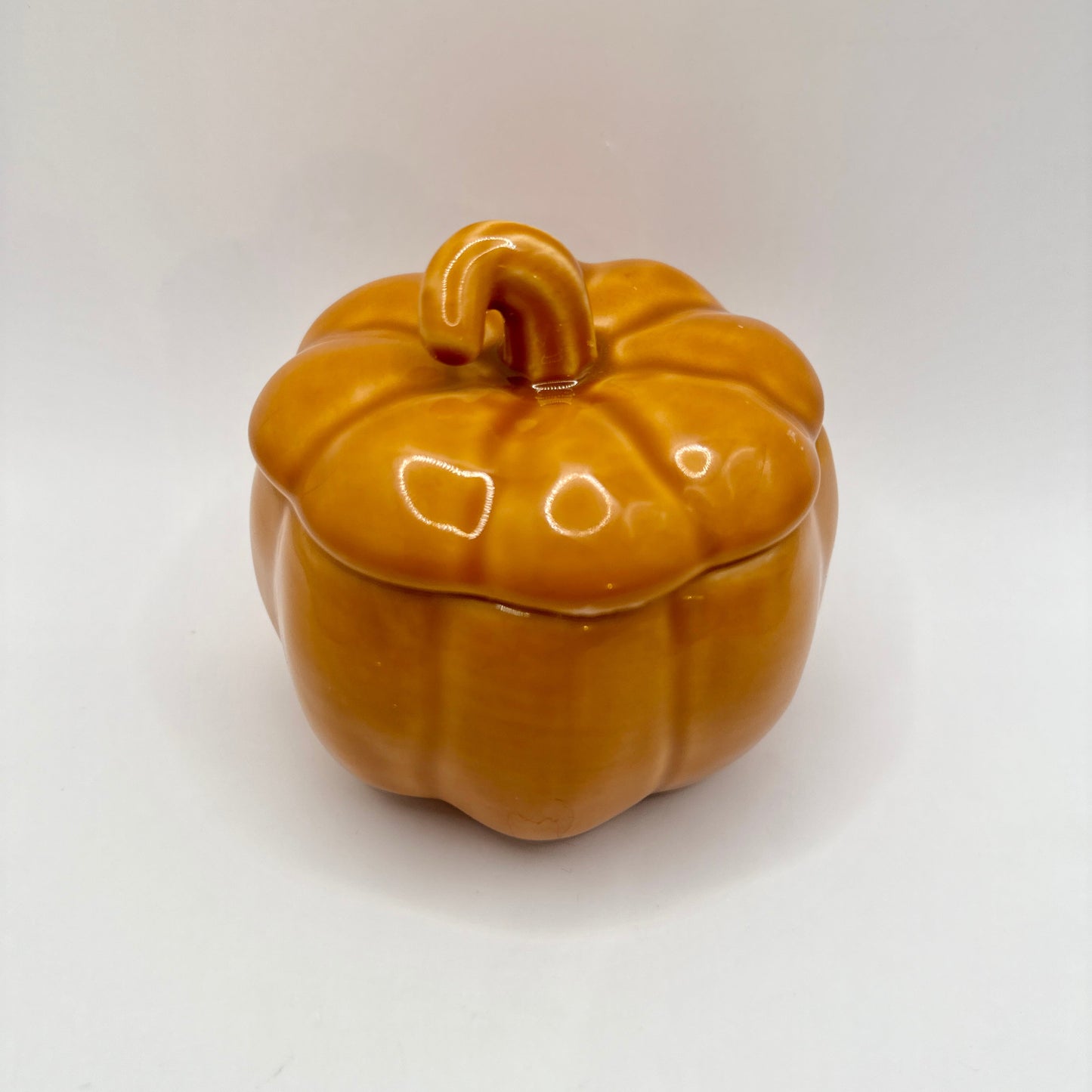 Ceramic pumpkin-shaped candle